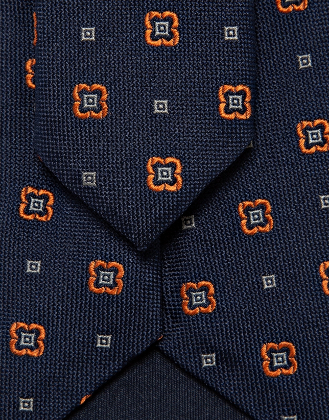 Navy silk tie with geometric orange flower jacquard pattern
