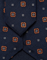 Navy silk tie with geometric orange flower jacquard pattern