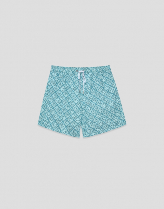 Blue-green and white geometric print swimsuit