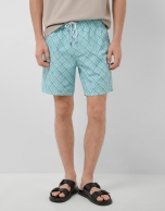 Blue-green and white geometric print swimsuit