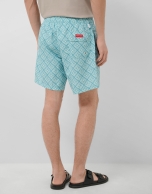 Blue-green and white geometric print swimsuit