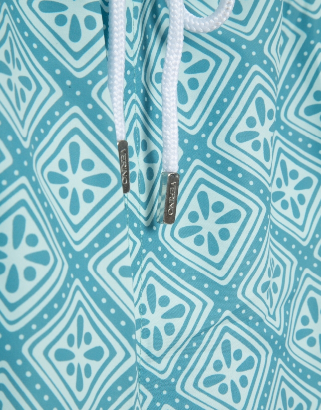 Blue-green and white geometric print swimsuit