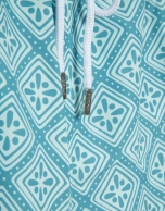 Blue-green and white geometric print swimsuit