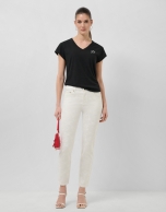 White five-pocket trousers with silver laminated print