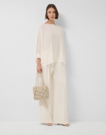 Long, flowing ecru blouse