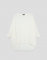 Long, flowing ecru blouse