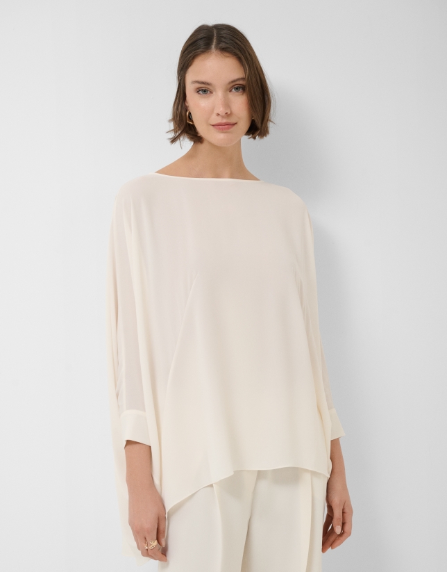 Long, flowing ecru blouse