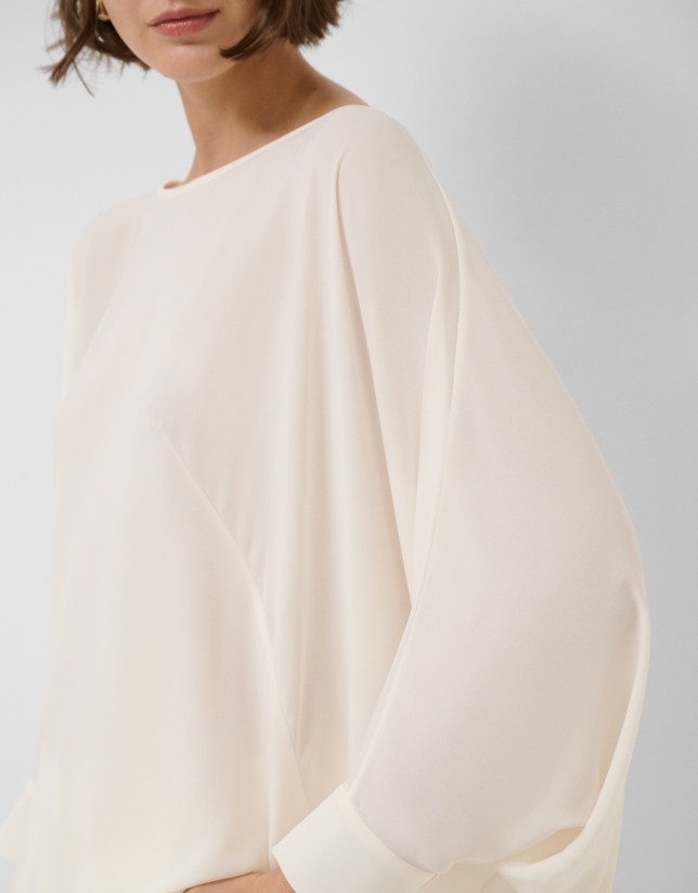 Long, flowing ecru blouse