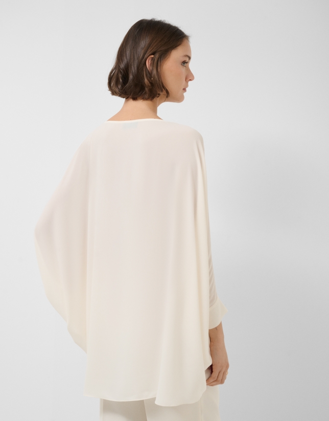Long, flowing ecru blouse