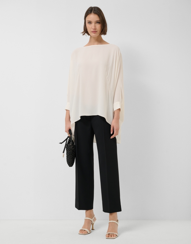 Long, flowing ecru blouse