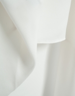 Long, flowing ecru blouse